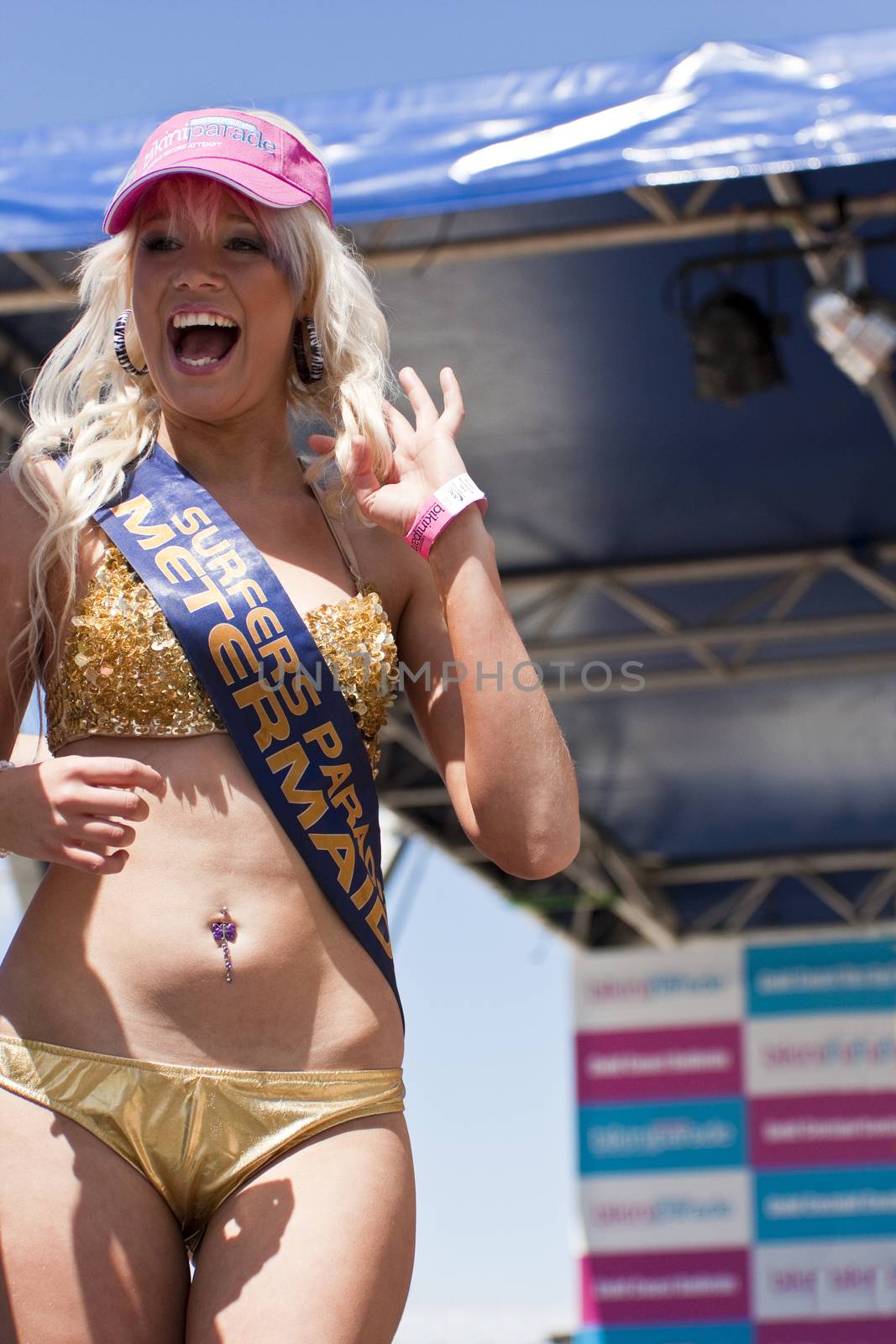 GOLD COAST, AUSTRALIA - OCTOBER 2: Unidentified participants prepare for march of successful Guinness World Record longest bikini parade on October 2,2011 in Gold Coast, Australia.