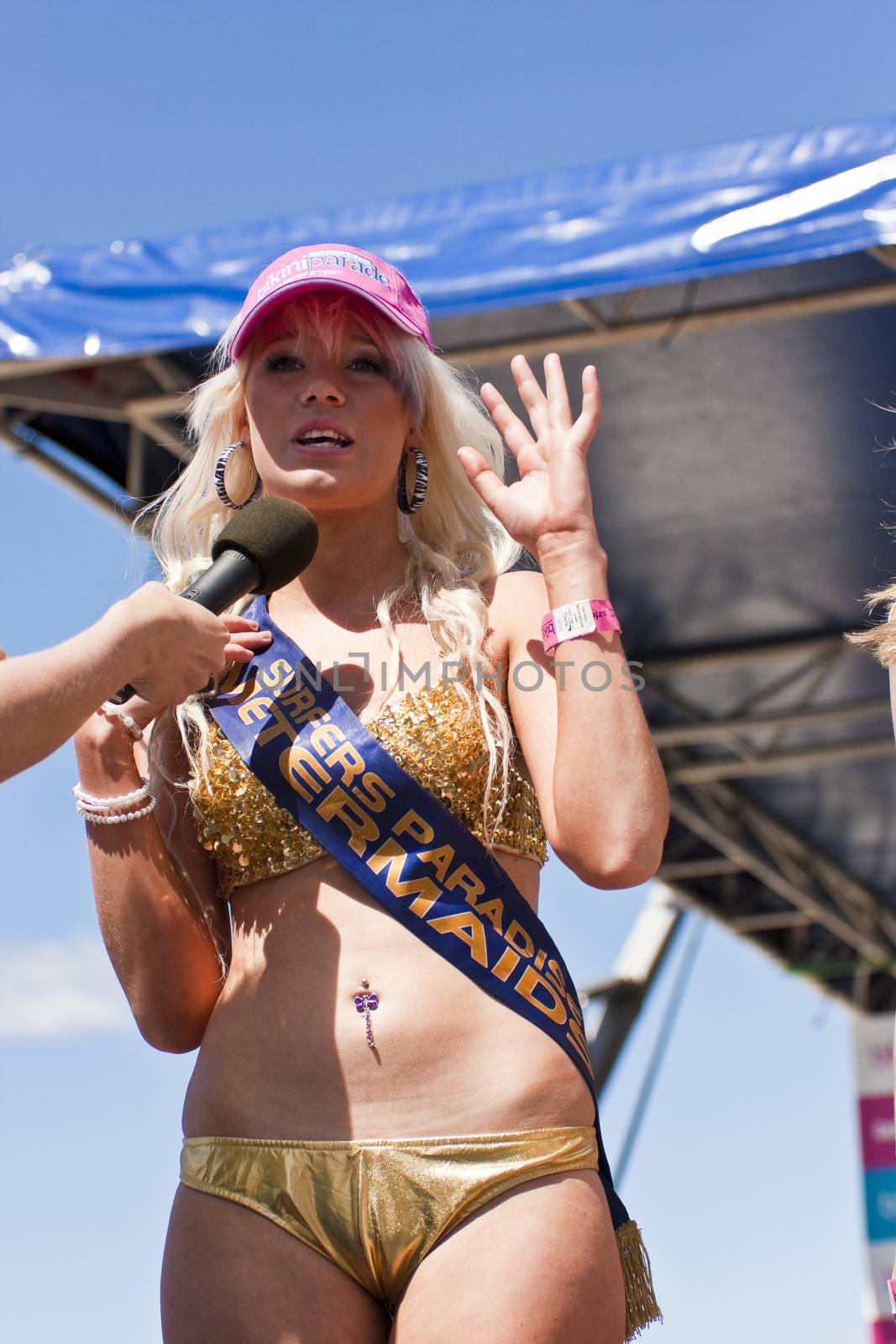 GOLD COAST, AUSTRALIA - OCTOBER 2: Unidentified participants prepare for march of successful Guinness World Record longest bikini parade on October 2,2011 in Gold Coast, Australia.