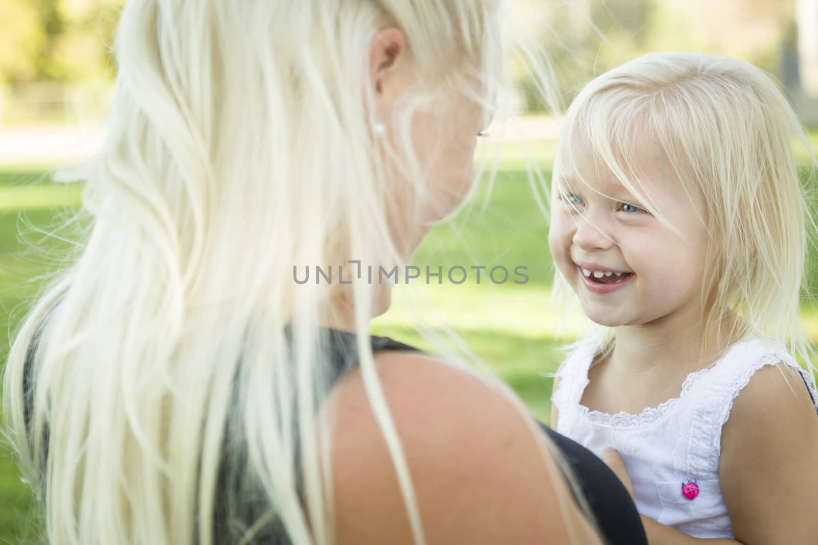 Cute Little Girl Having Fun With Her Mother Outside.