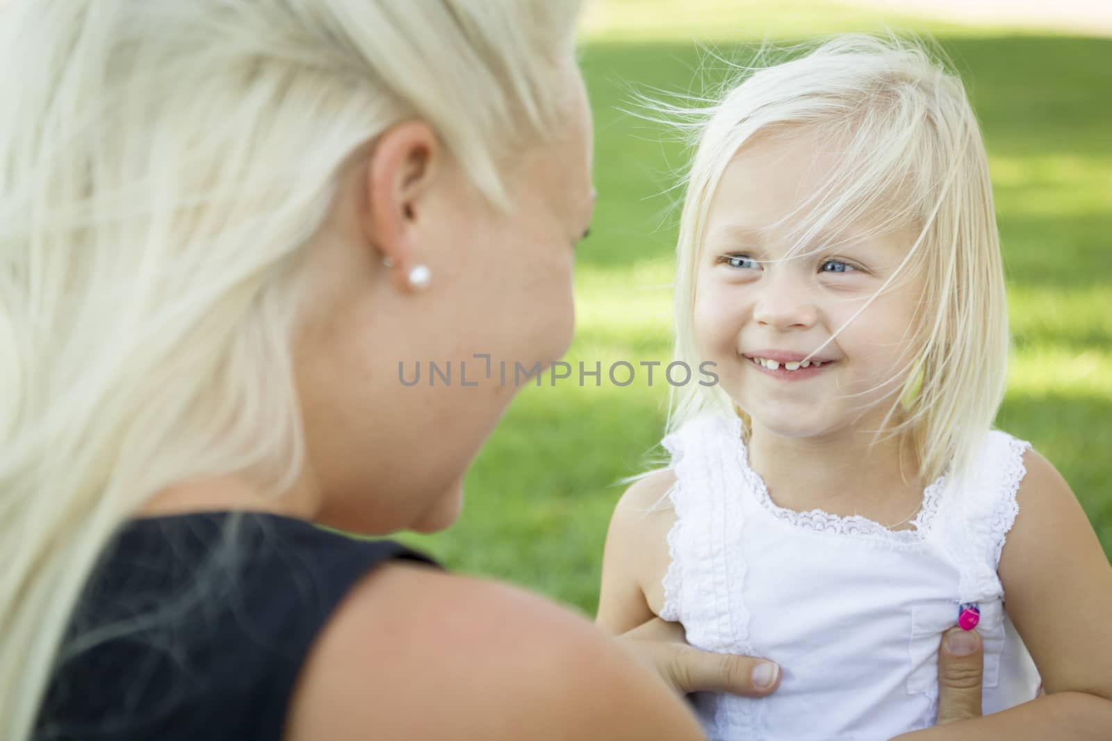 Cute Little Girl Having Fun With Her Mother Outside.