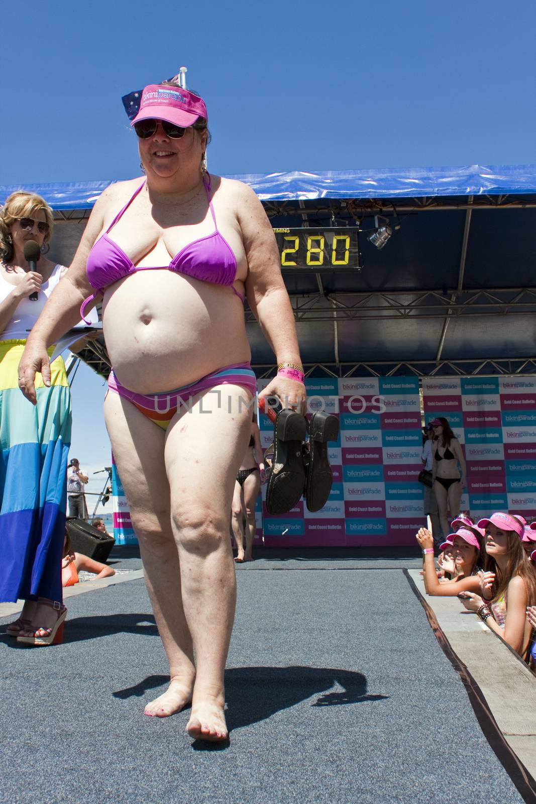 GOLD COAST, AUSTRALIA - OCTOBER 2: Unidentified participants prepare for march of successful Guinness World Record longest bikini parade on October 2,2011 in Gold Coast, Australia.