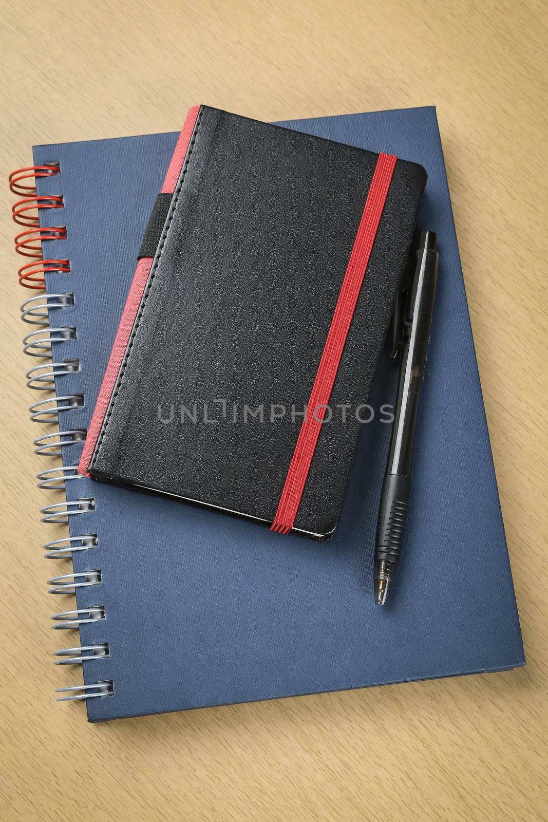 pen and notebook on wooden table, business , education