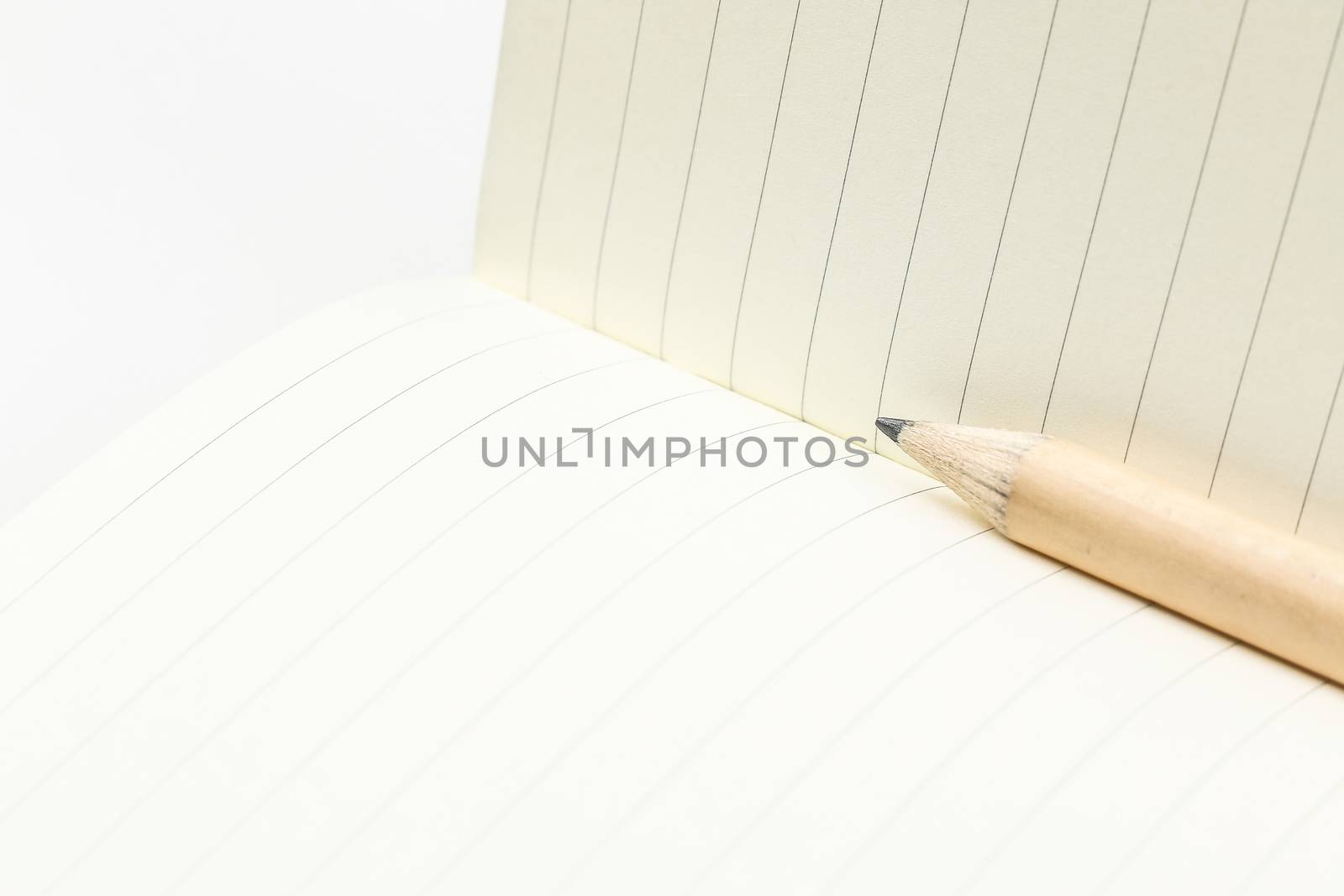 pencil and blank opened notebook by simpleBE