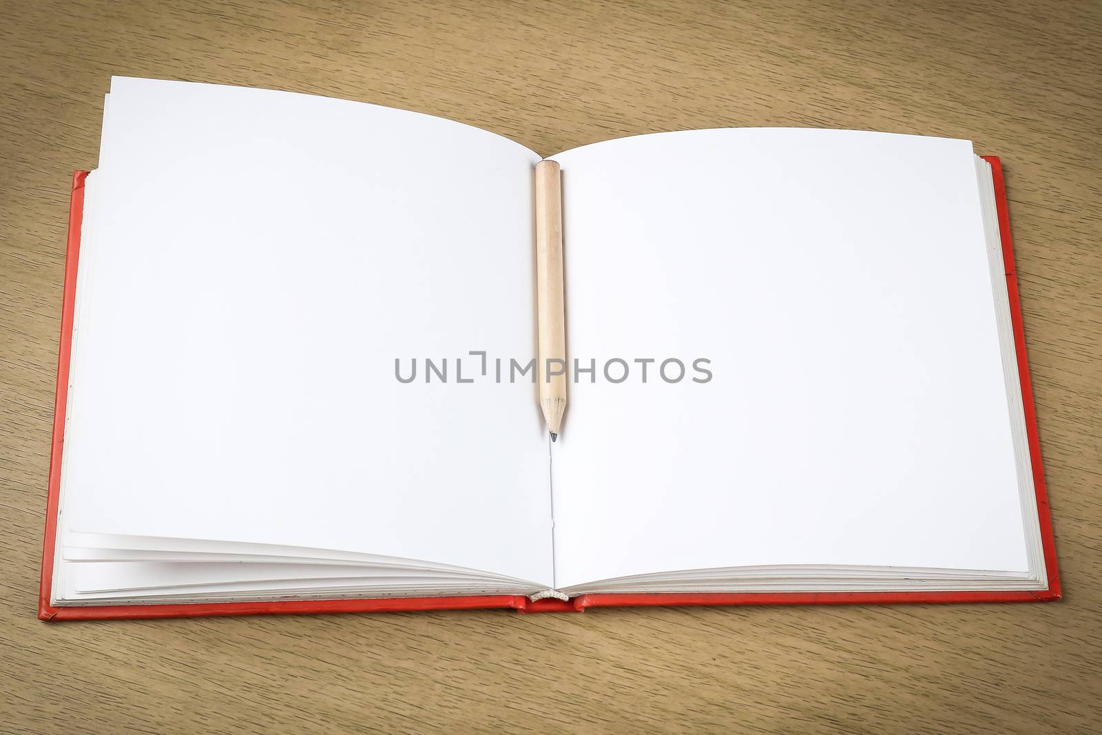 pencil and blank opened notebook , business , education