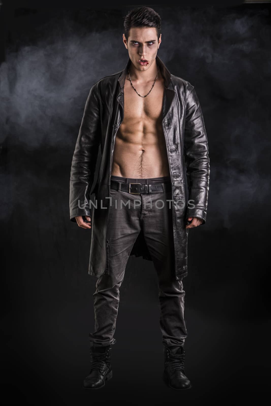 Young Vampire Man in an Open Black Leather Jacket, Showing his Chest and Abs by artofphoto