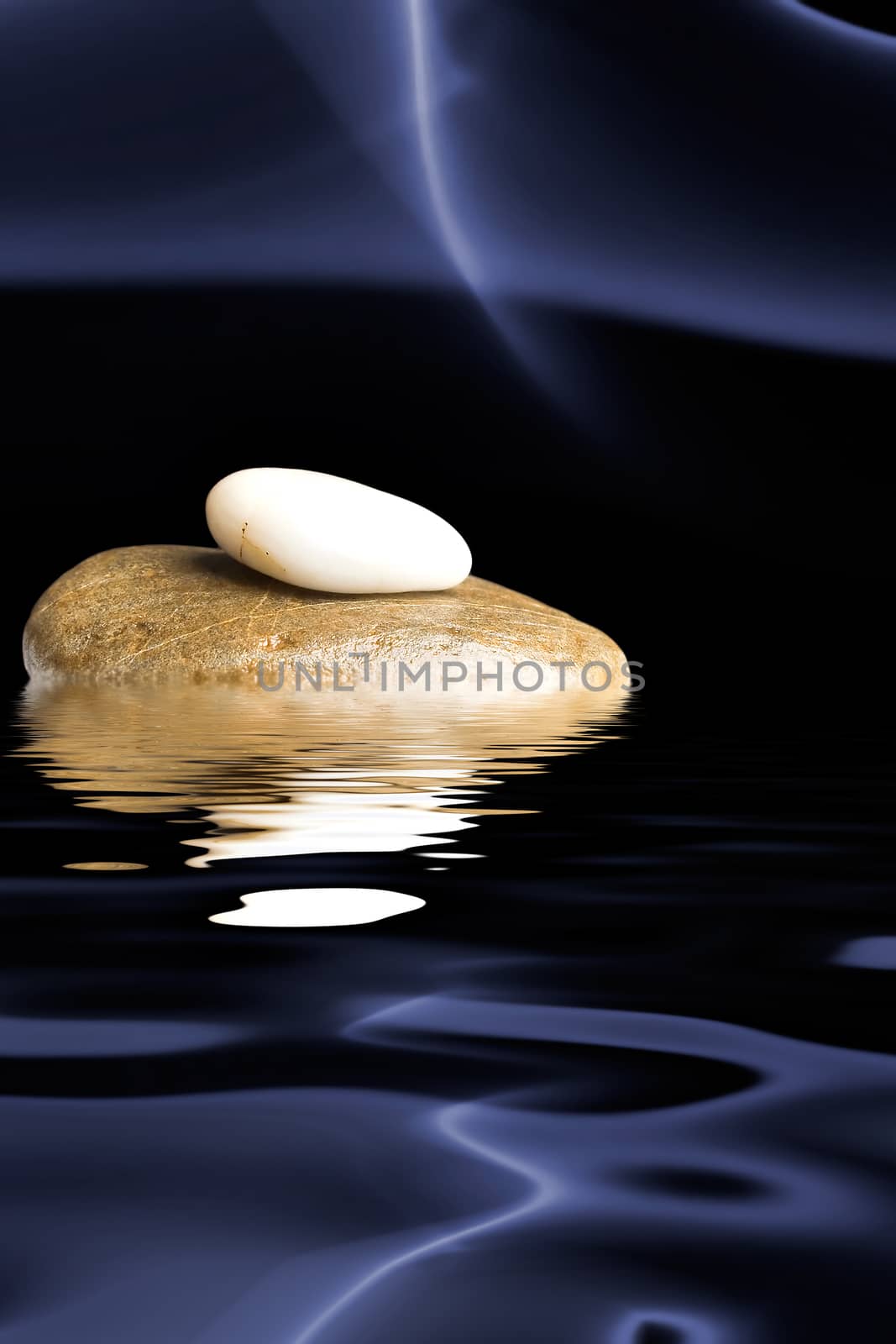 Zen stones on black background with blue smoke reflected in water