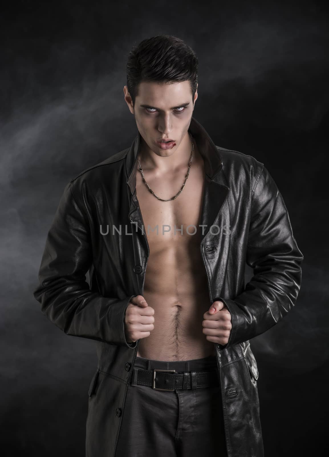 Young Vampire Man in an Open Black Leather Jacket, Showing his Chest and Abs by artofphoto