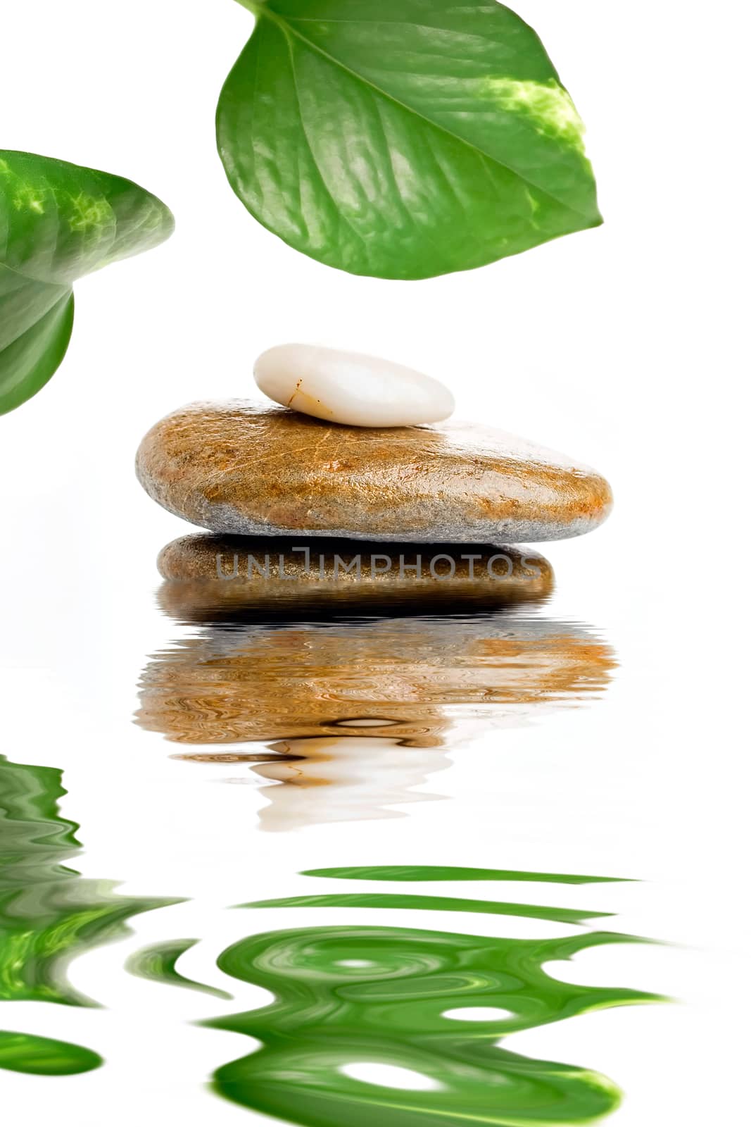 Composition of stones on water creating reflections