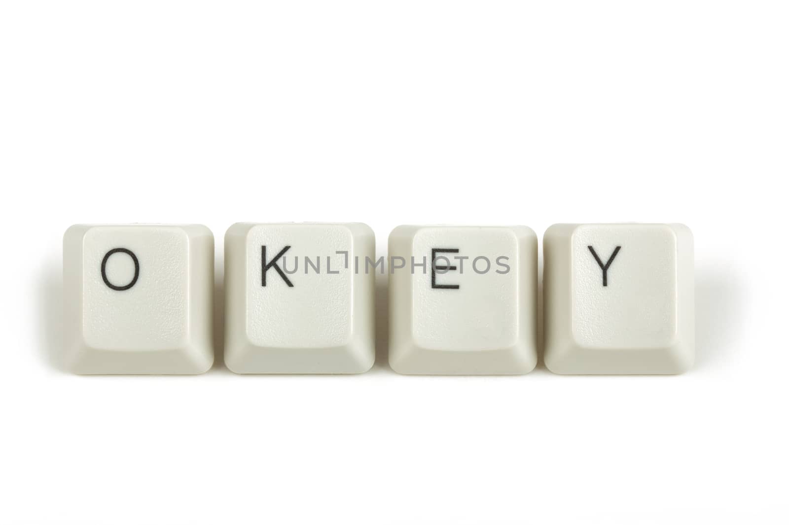 okey text from scattered keyboard keys isolated on white background