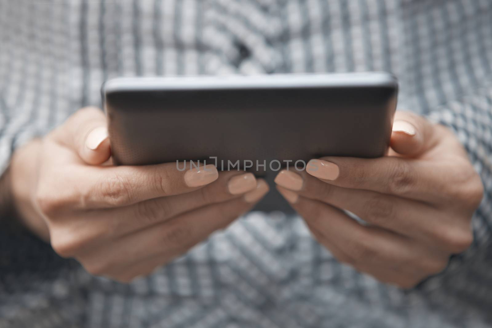 Hands of woman using digital tablet