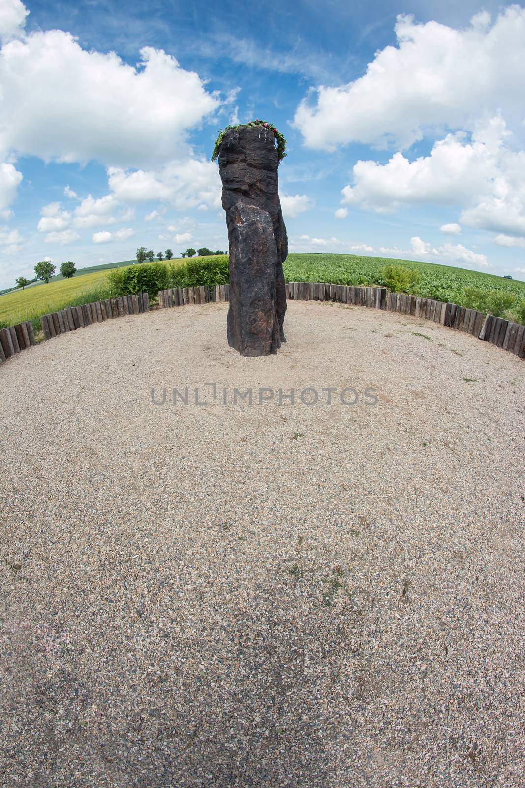 Menhir Stone Shepherd (also Stone Man, Petrified Man or Petrified minister) is a menhir standing alone in a field 1 km northwest of the village Klobuky, district Kladno. This is the highest menhir in the Czech Republic.  3.5 m tall columnar rock uncut dark iron Cretaceous sandstone. This is one of the few stones in the country, which we can with high probability be considered a real prehistoric menhir.