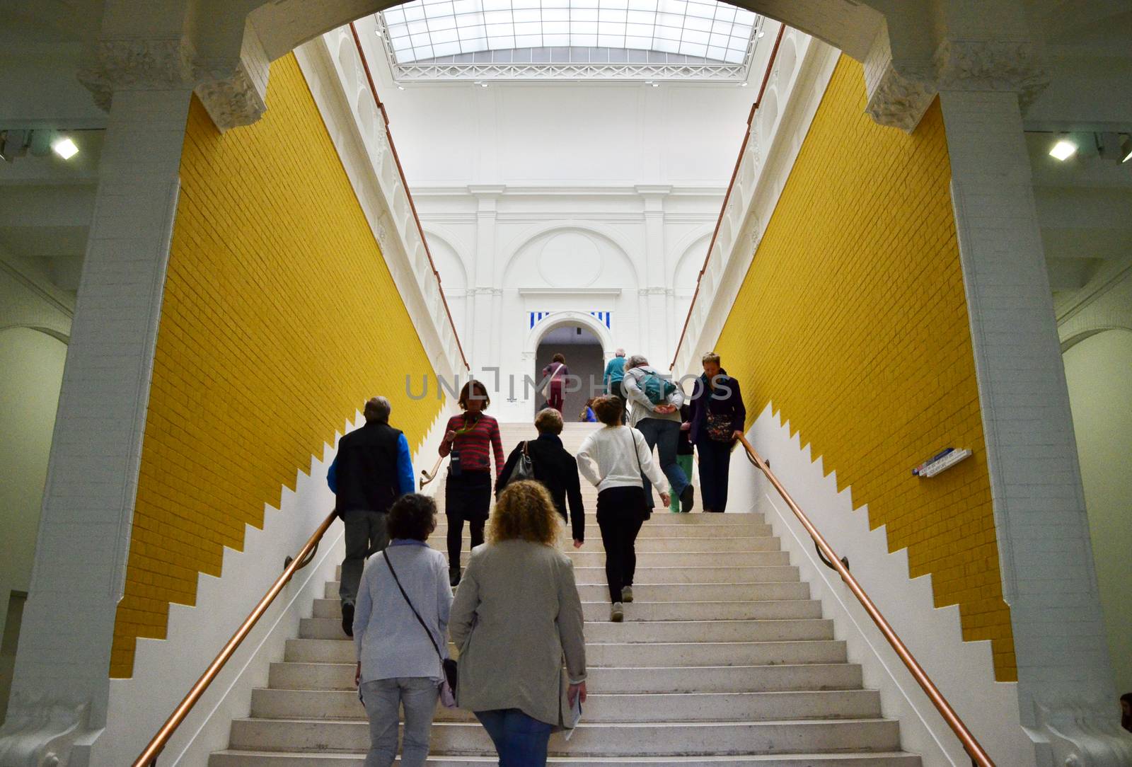 Amsterdam, Netherlands - May 6, 2015: People visit Stedelijk Museum in Amsterdam located in the museum park, Netherlands on May 6, 2015