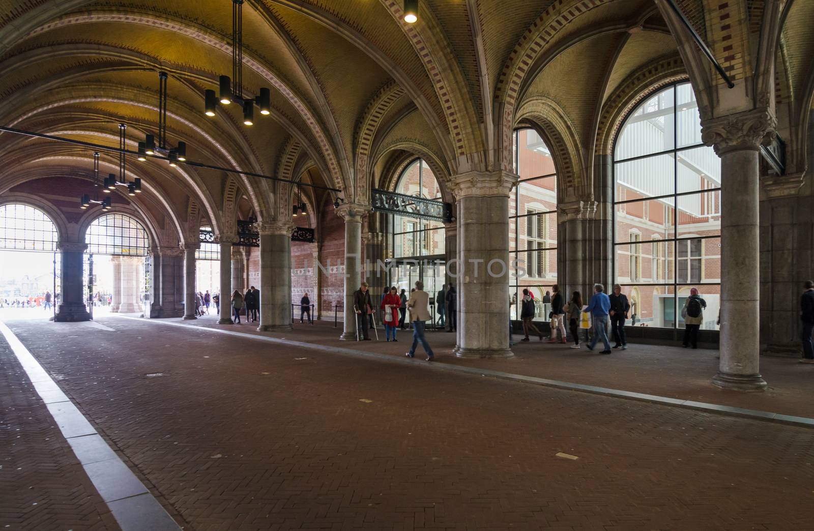 Amsterdam, Netherlands - May 6, 2015: People at main entrance of the Rijksmuseum passage by siraanamwong