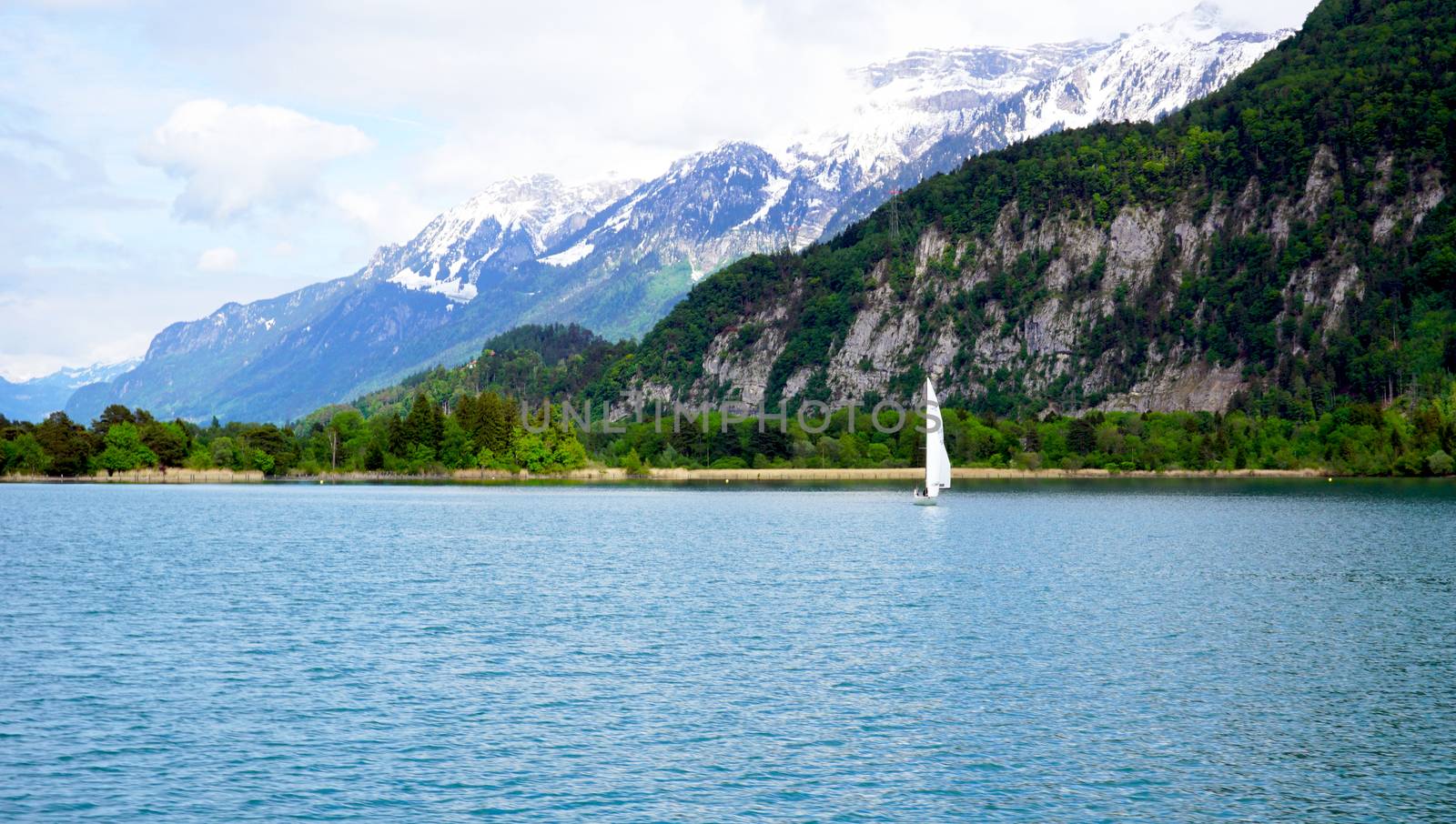 Scenic of Thun Lake and sail boat Interlaken, Switzerland