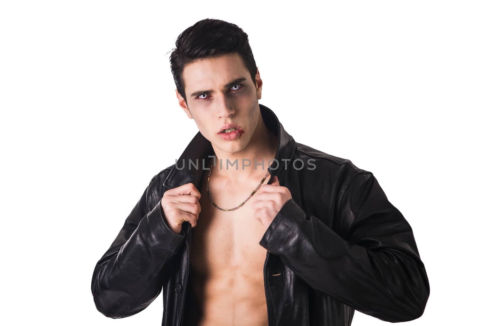 Portrait of a Young Vampire Man in an Open Black Leather Jacket, Showing his Chest and Abs, Looking at the Camera, Isolated on a White Background.