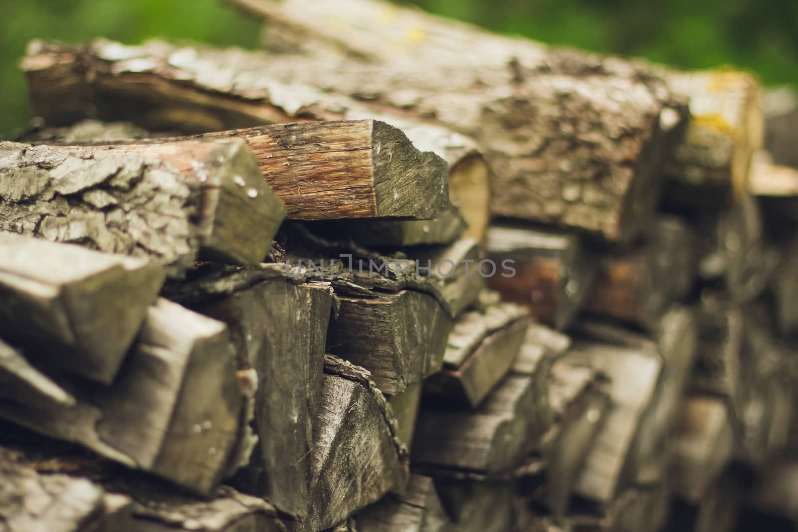 A stack of firewood close up with a large depth of field