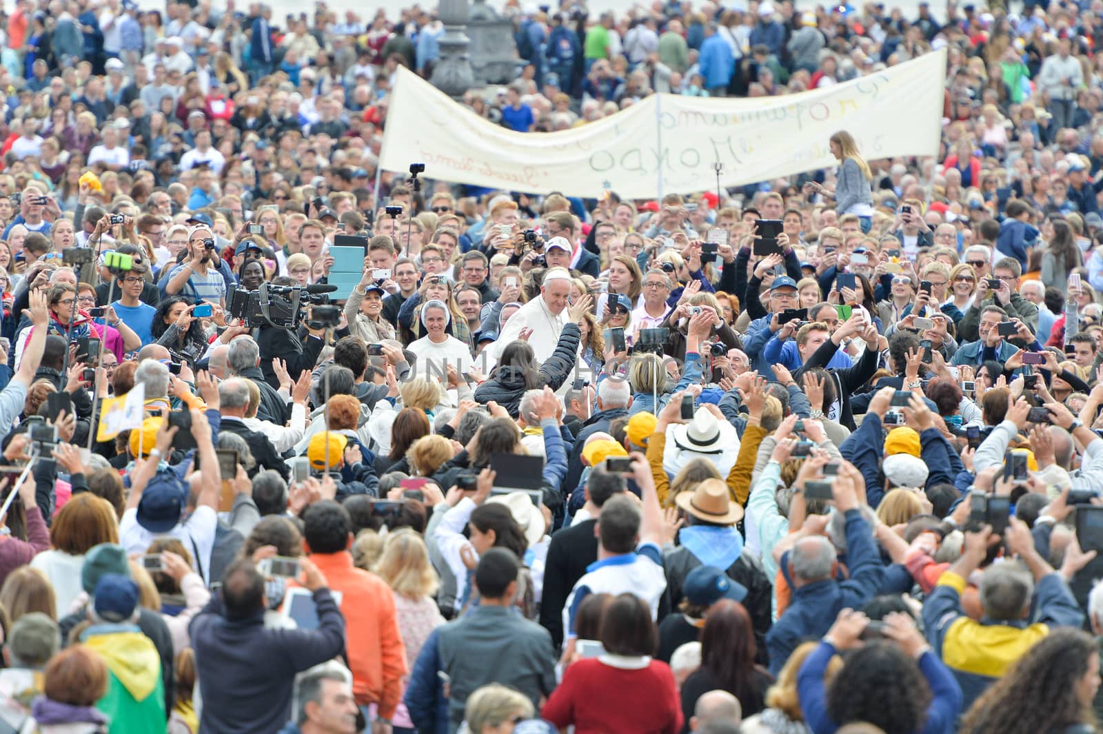 VATICAN, Vatican City: Pope Francis is surrounded by a crowd at his weekly general audience at St. Peter's Square on September 30, 2015, after returning from a tour of the U.S. and Cuba. 