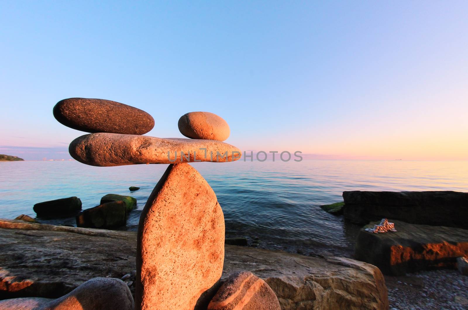 Symbol of scales is made of pebbles on the seashore