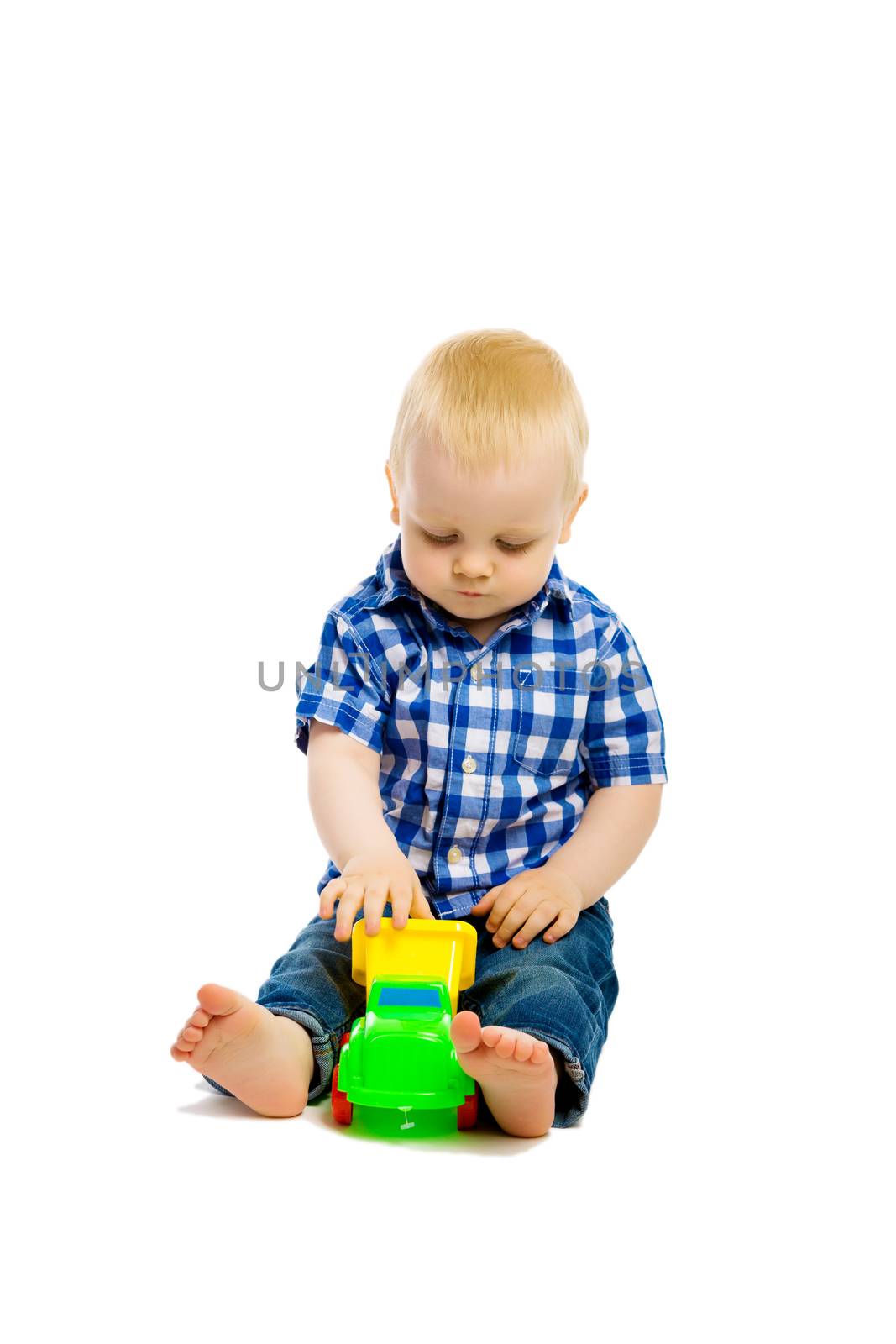 Baby boy playing with toys. isolated by pzRomashka