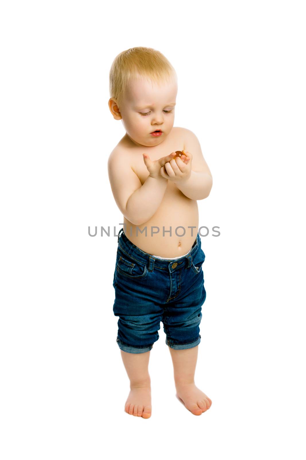 Curious baby boy looks at something. Full length. Studio. isolated