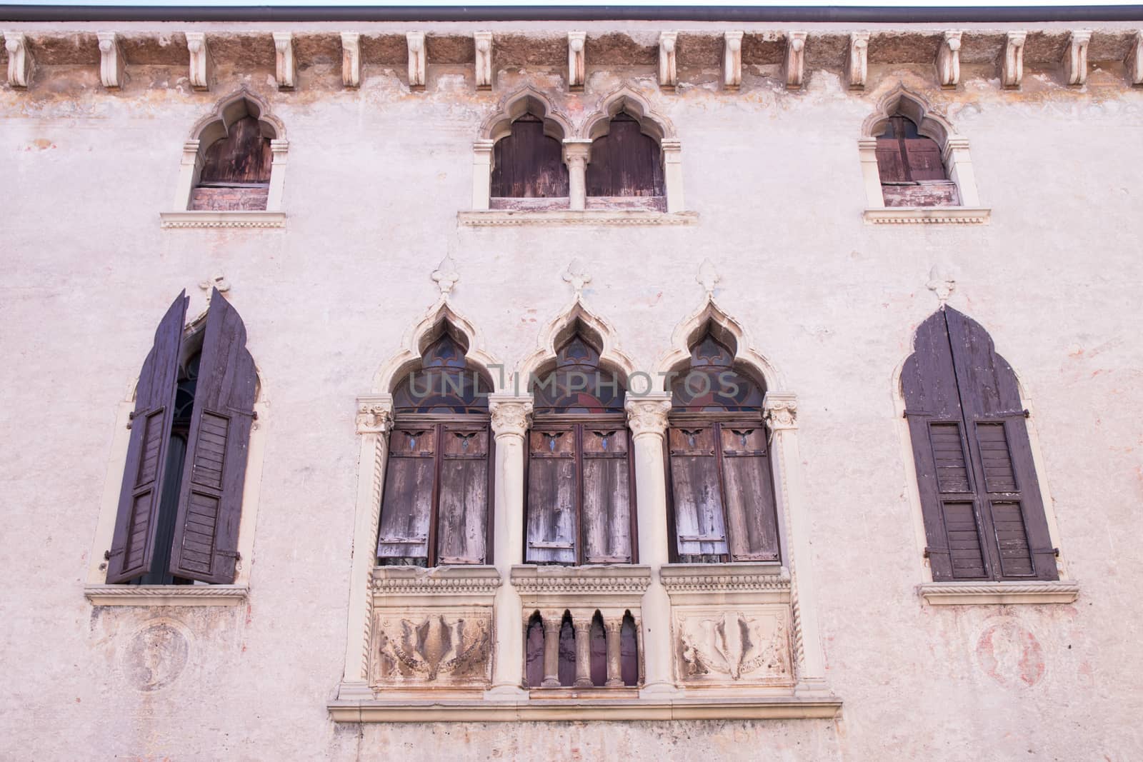 old windows on a medieval palace facade in Verona by Isaac74