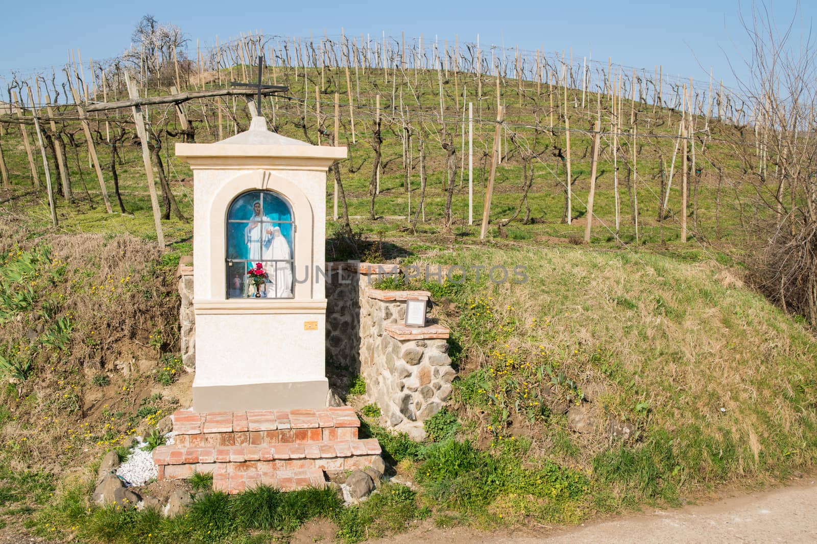 Italian traditional votive temple in the countryside dedicated to the Virgin Mary to propitiate the harvest