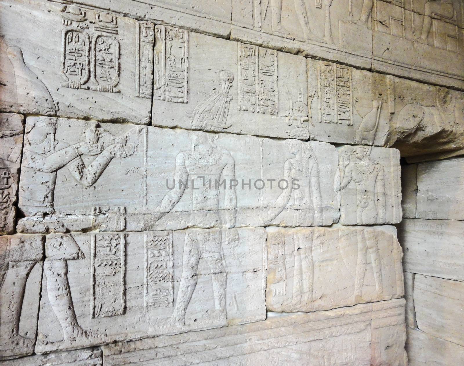 Egyptian bas relief on the stone facade of the temple