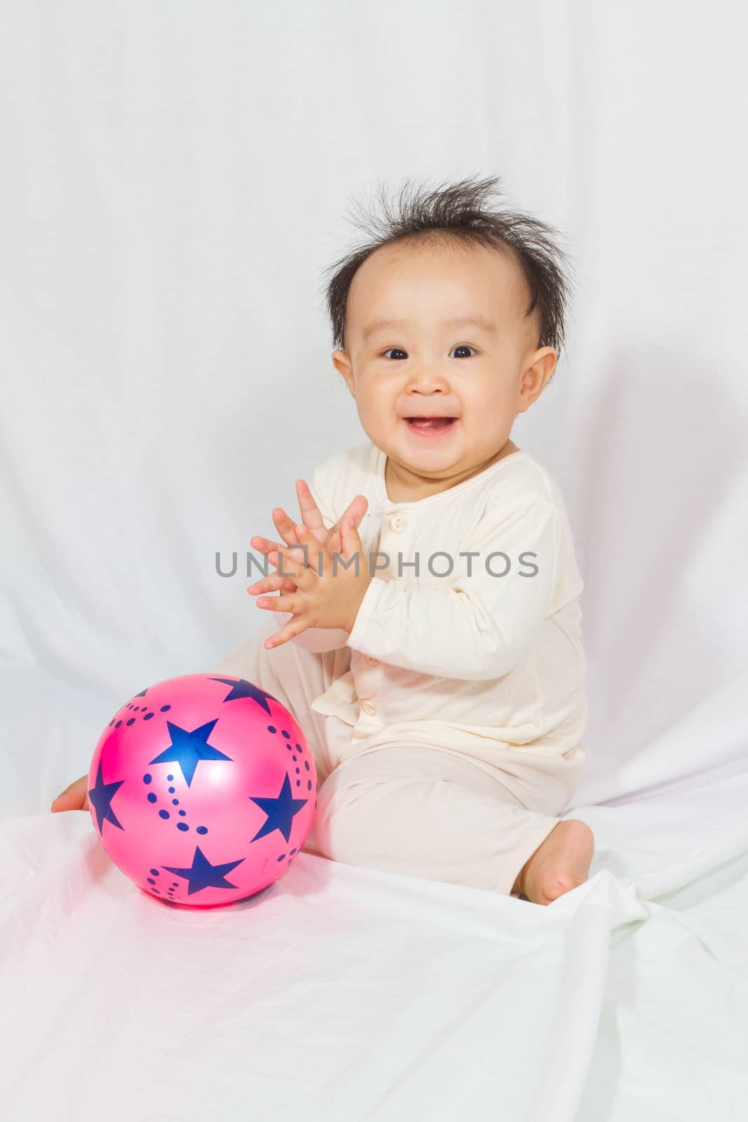Asian Chinese baby smalling in white background