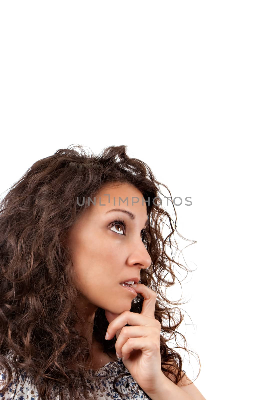 Beautiful lady thinking and looking up on a white background