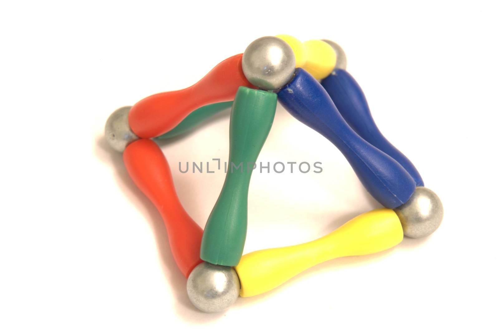Color balls and a metal ball on white background created an abstract construction, connected, isolated
