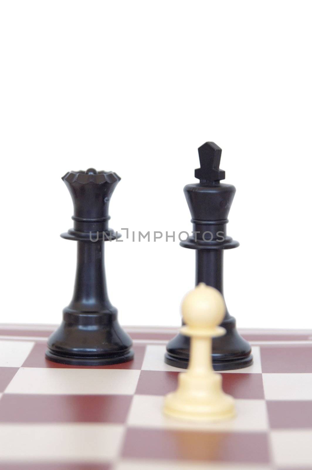   white man wirh black king and queen on a chess board