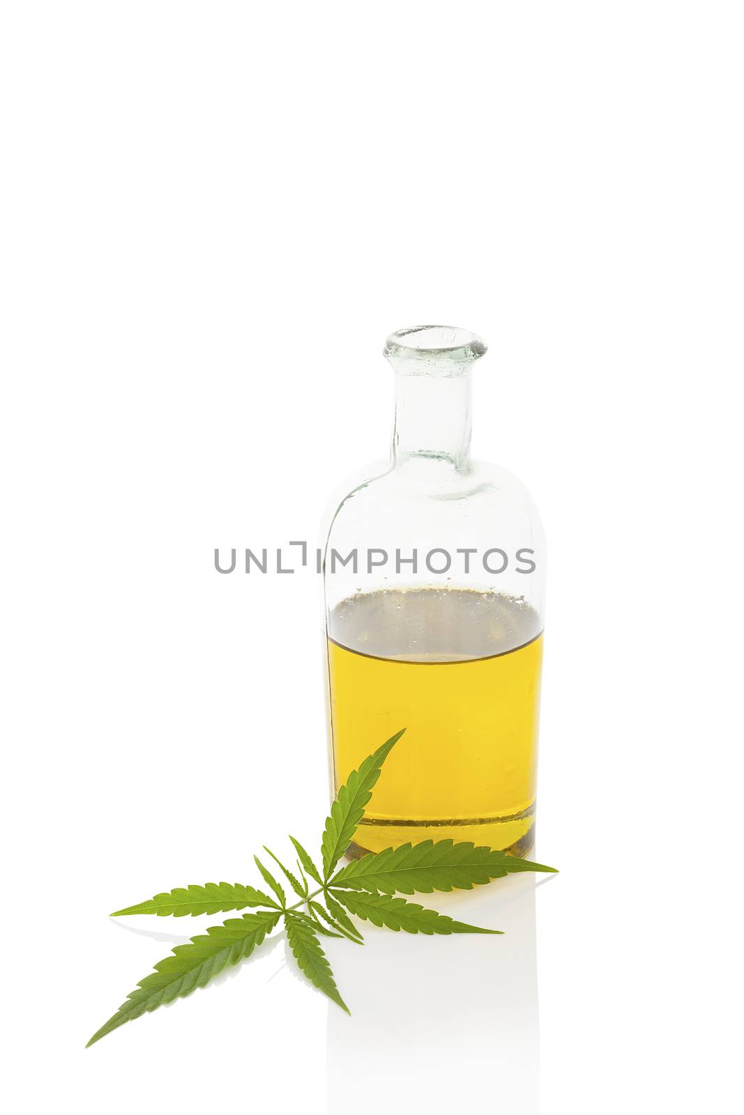 Hemp oil and cannabis leaf isolated on white background. Healthy cannabis oil. 