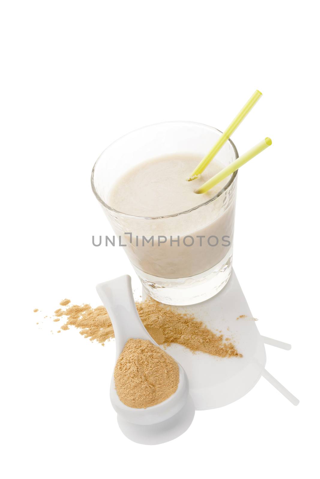 Maca powder on spoon and maca milkshake in glass isolated on white background. Natural alternative medicine.