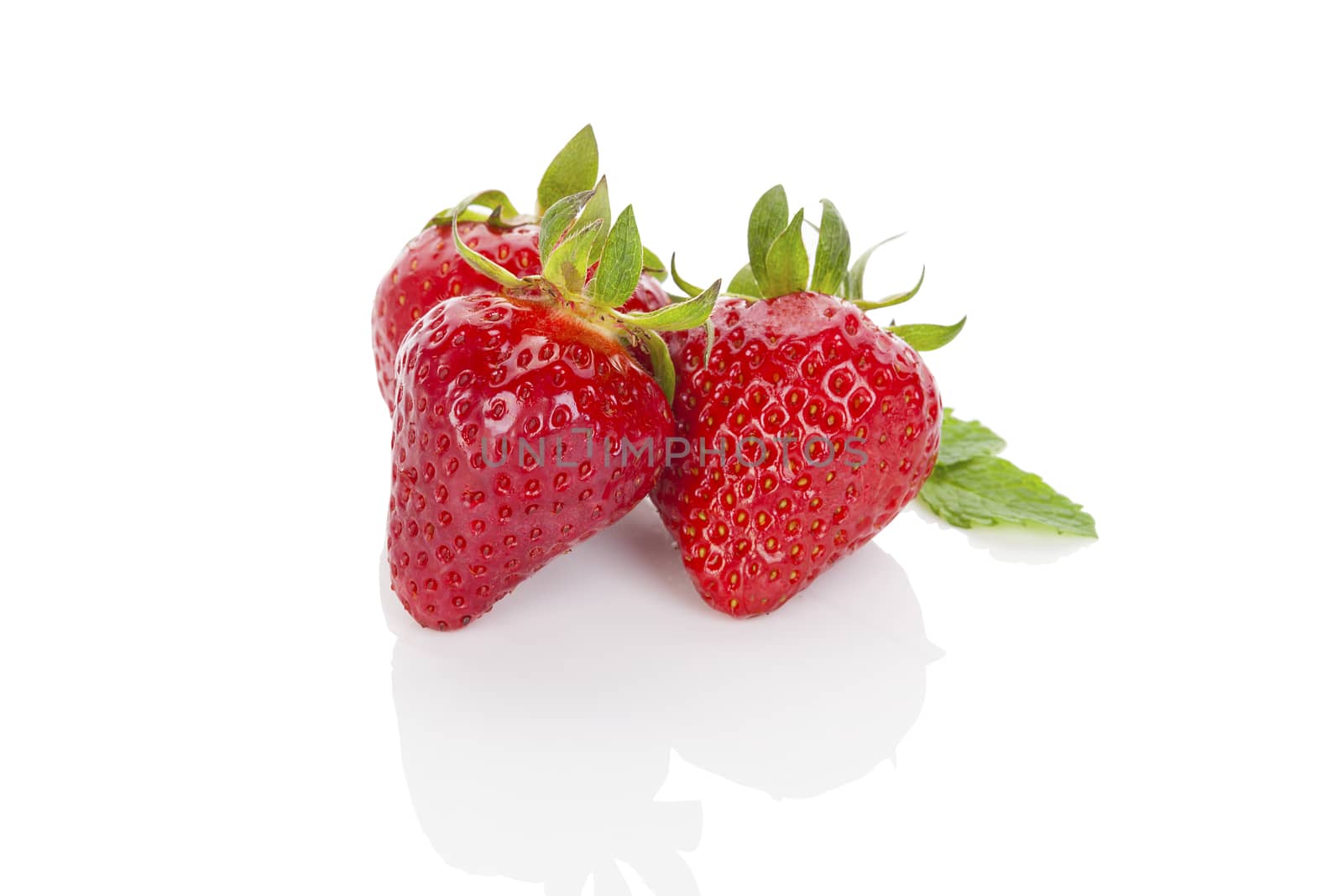 Delicious ripe strawberries isolated on white background. Healthy fruit eating.