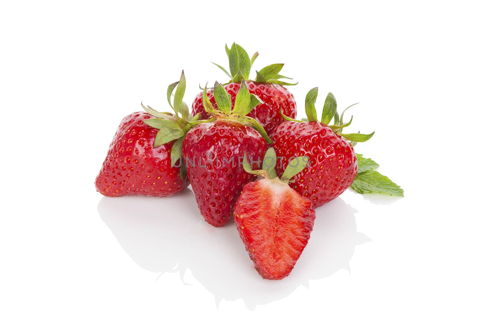 Delicious ripe strawberries isolated on white background. Healthy fruit eating.