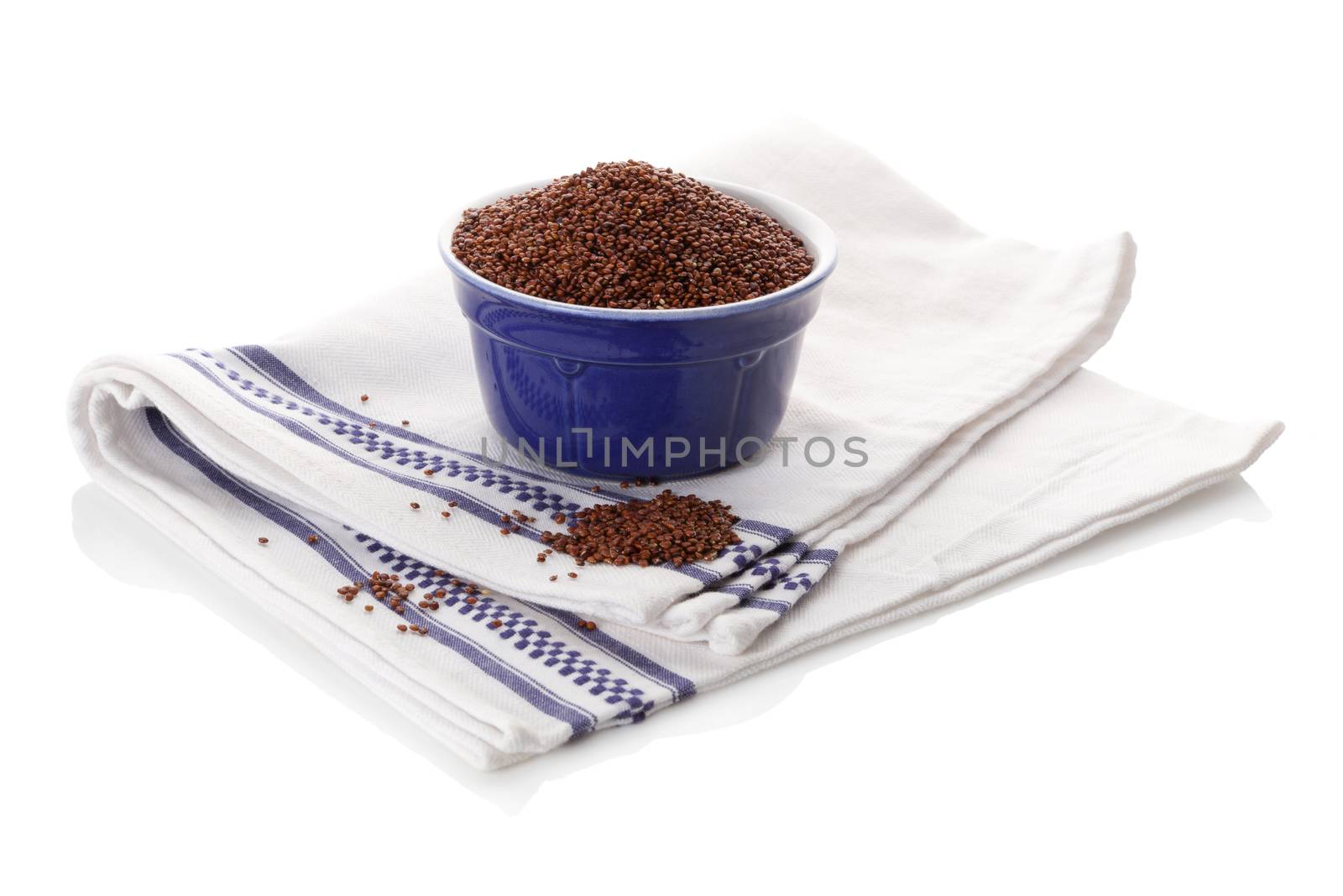 Quinoa seeds in bowl on white background. Healthy eating, dietary supplement.