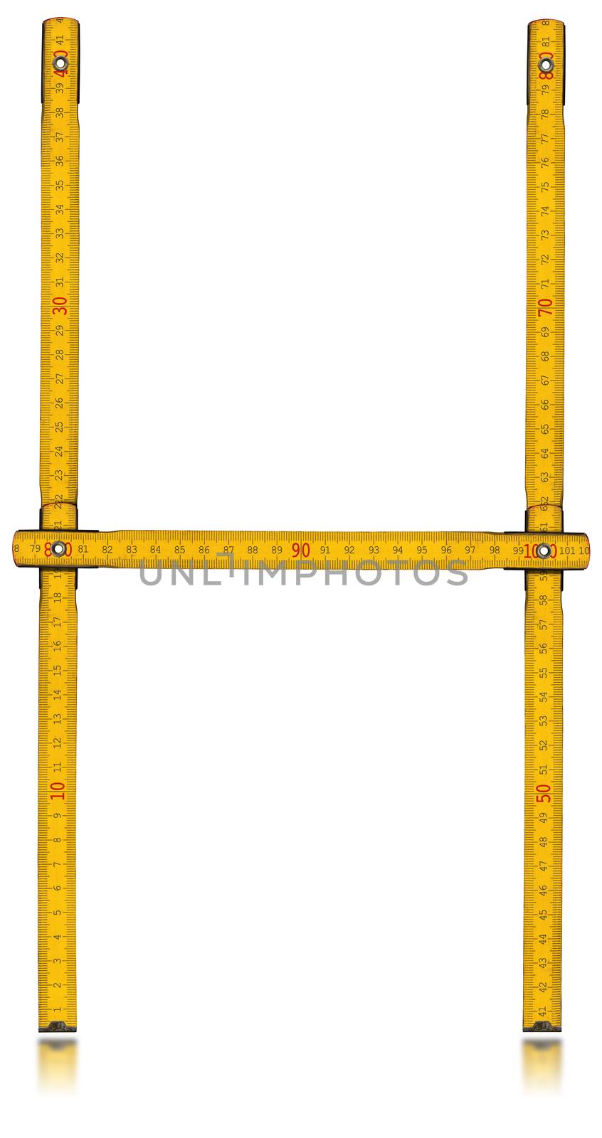 Old wooden yellow meter in the shape of letter H. Isolated on white background.