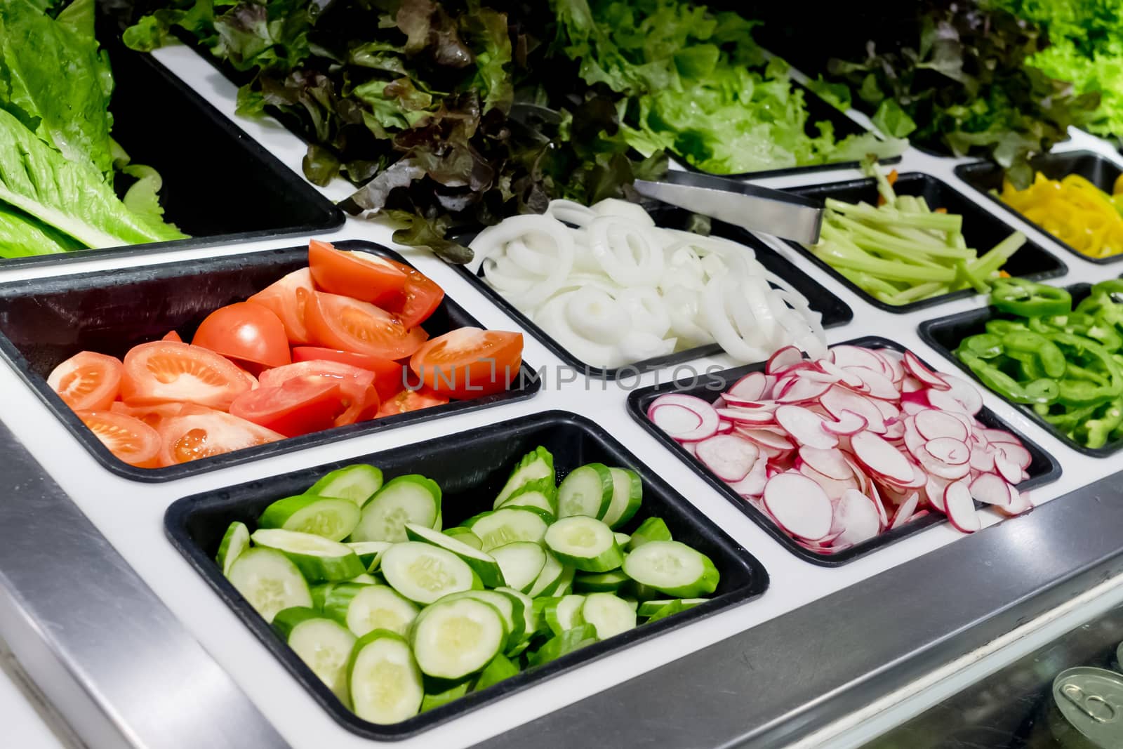 salad bar with vegetables in the supermarket, healthy food by art9858