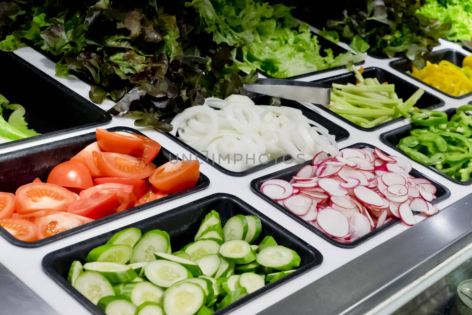salad bar with vegetables in the supermarket, healthy food by art9858