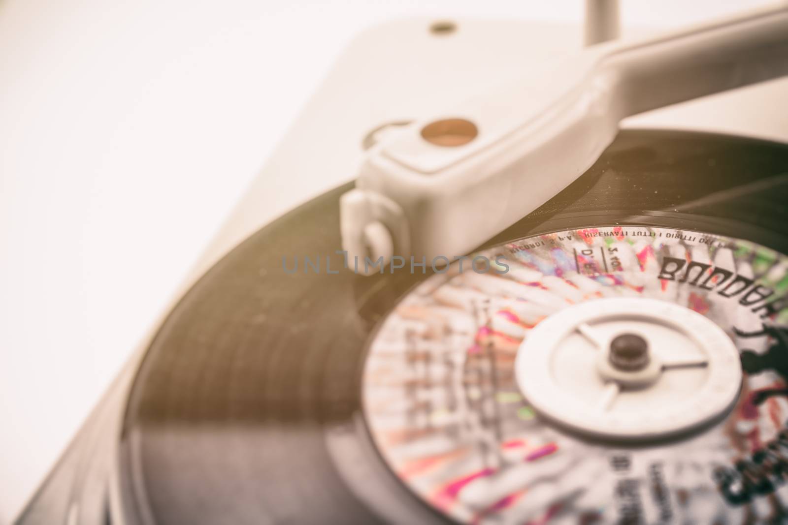 composition with vintage record player and old record