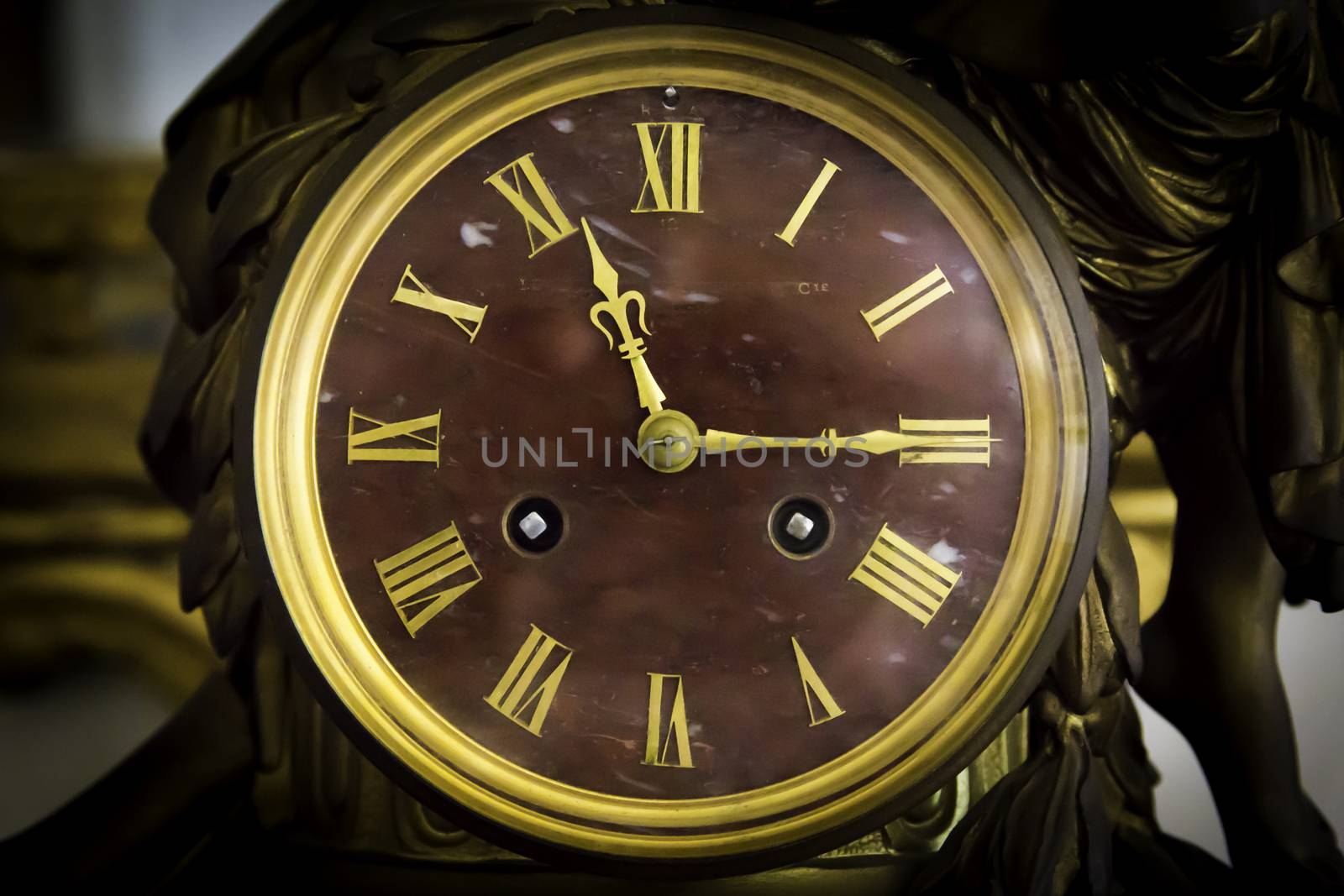 detail of antique table clock with manual winding