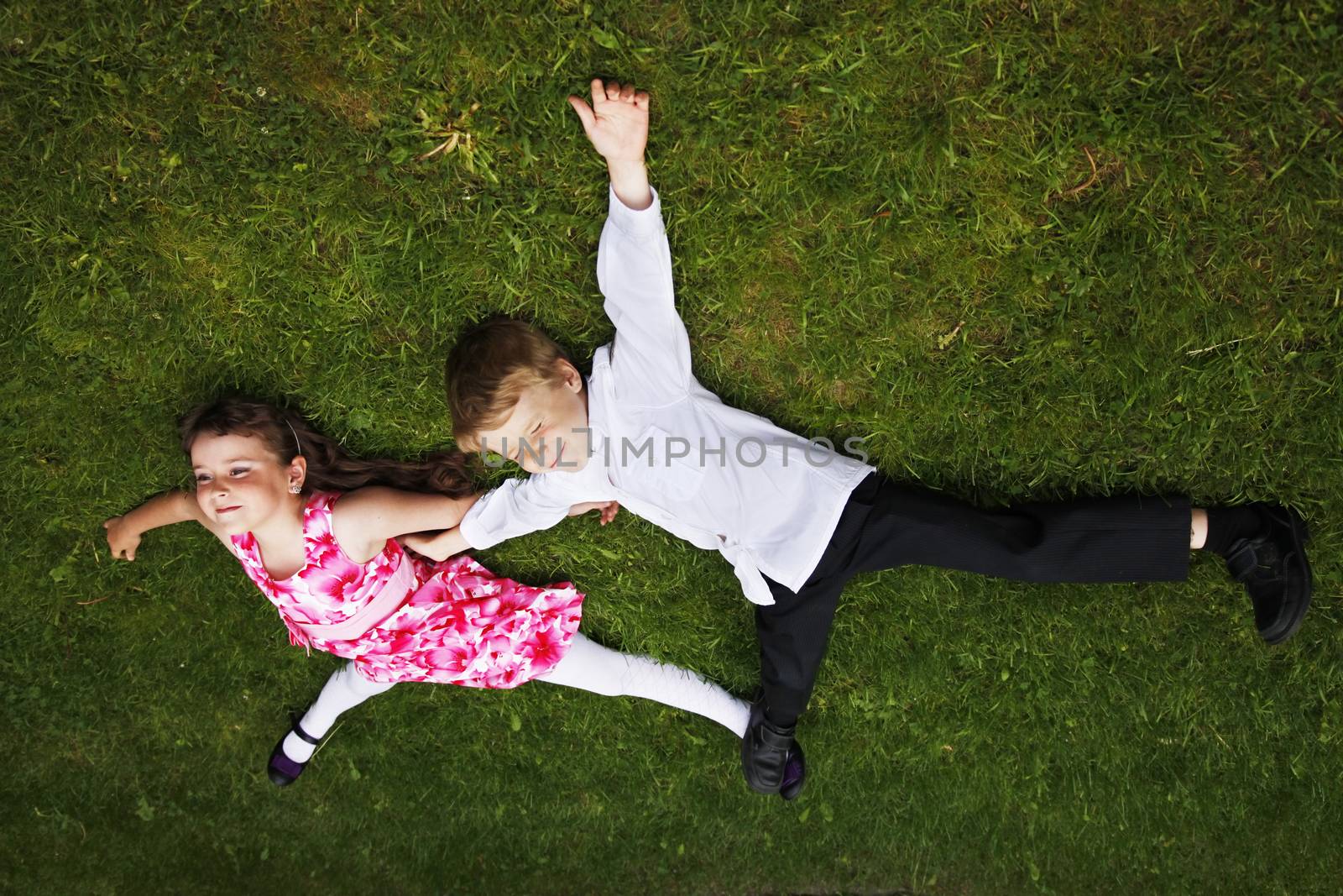 Brother and sister outdoors smiling