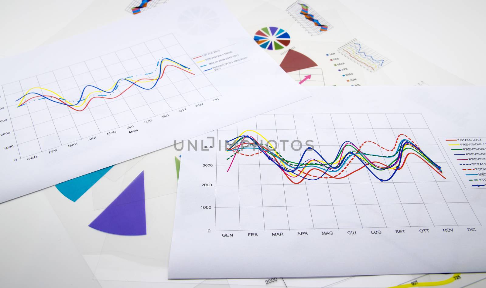 stack of paper documents with financial reports and statistic information data on white background