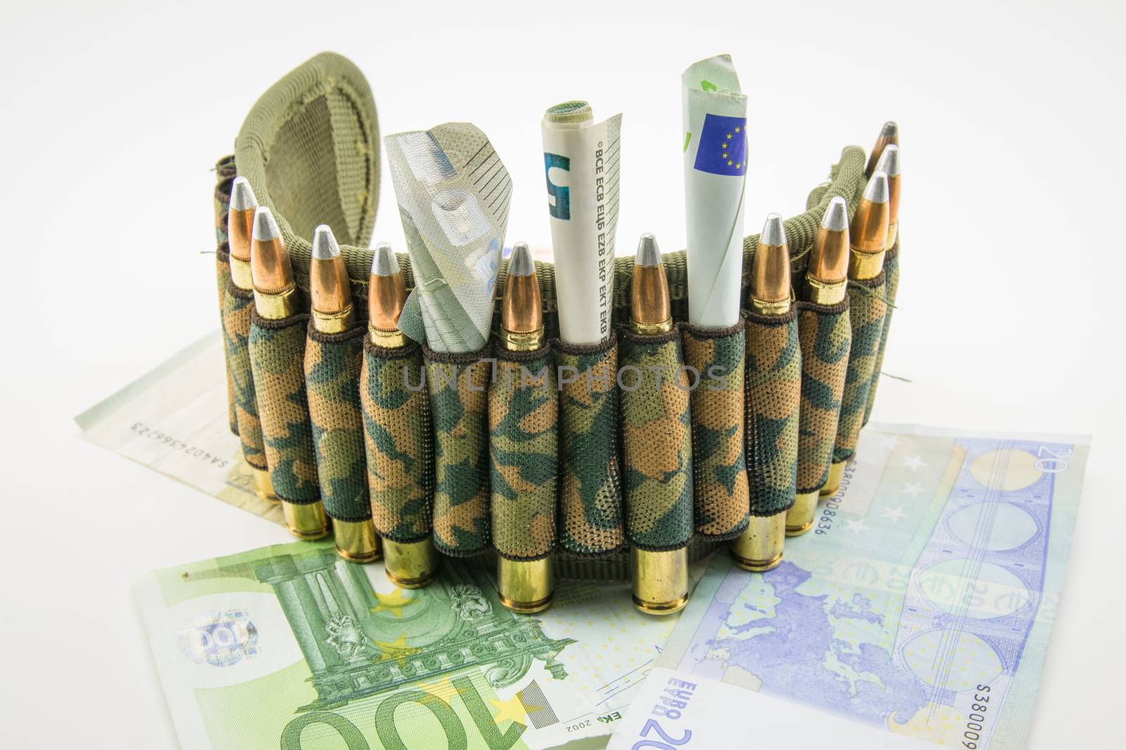 composition with a camouflage belt, bullets and banknotes