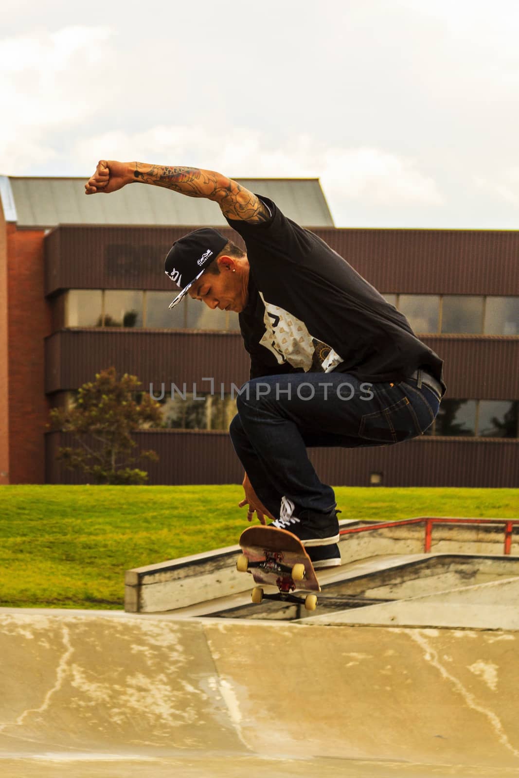 CALGARY, CANADA - JUN 21, 2015: Athletes have a friendly skateboard competition in Calgary. California law requires anyone under the age of 18 to wear a helmet while riding a skateboard.