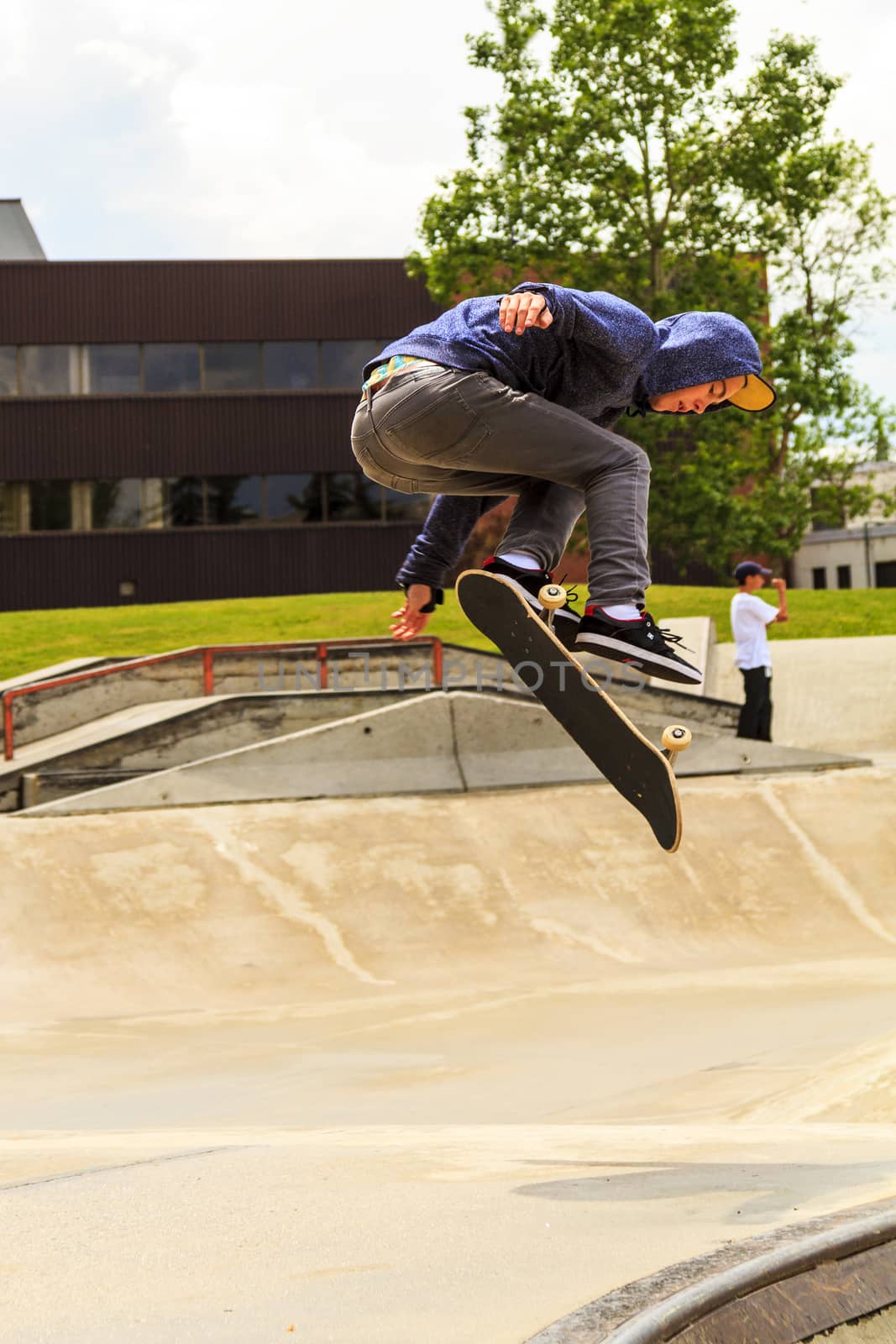 CALGARY, CANADA - JUN 21, 2015: Athletes have a friendly skateboard competition in Calgary. California law requires anyone under the age of 18 to wear a helmet while riding a skateboard.