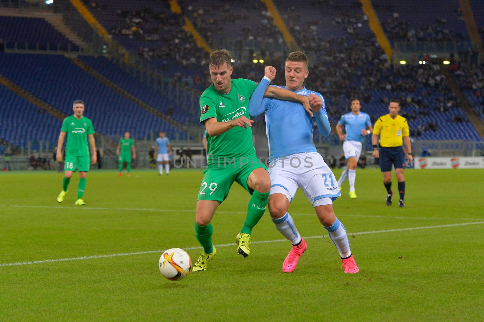 ITALY, Rome: Sergej Milinkovic Savic of SS Lazio (right) fights for the ball with Francois Clerc of AS Saint-Etienne during a Group G match in the group stage of the UEFA Europa League at Rome's Olympic Stadium on October 1, 2015. SS Lazio won the match with a score of 3-2.