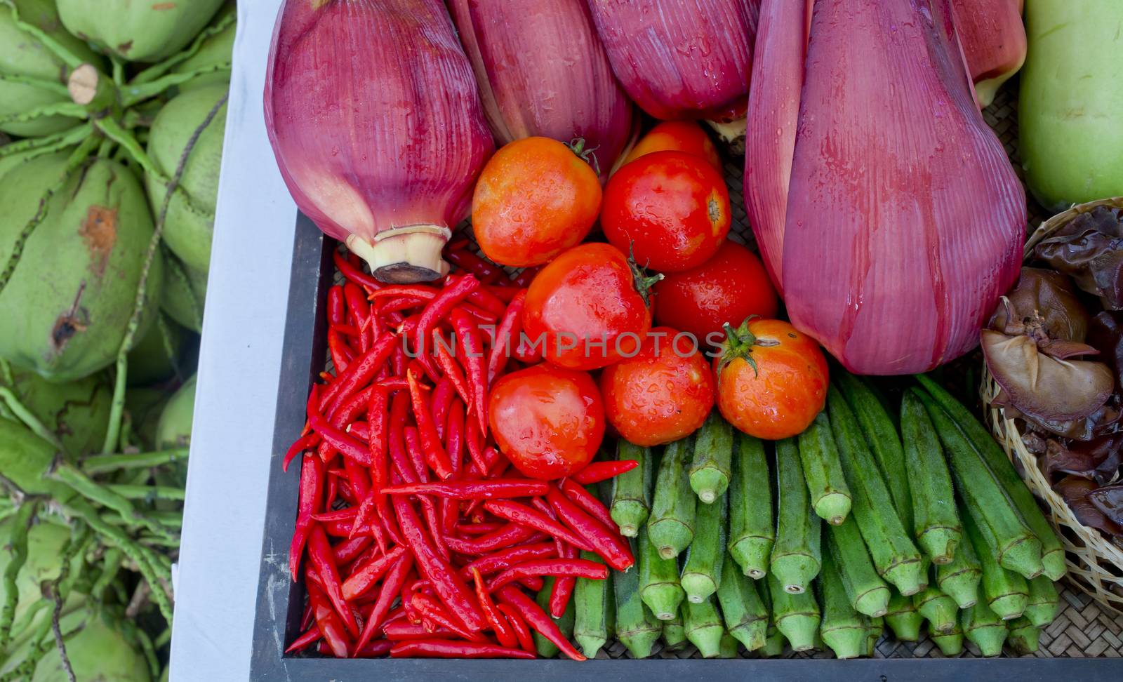 Kind of Thai vegetables set in Thai kitchen style, Tomatoes, Chilli, Banana Blossom, Green roselle.