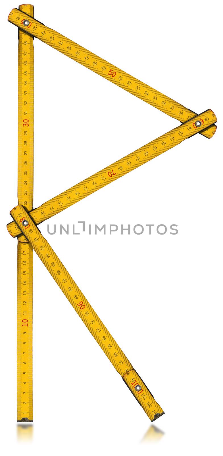 Old wooden yellow meter in the shape of letter R. Isolated on white background.