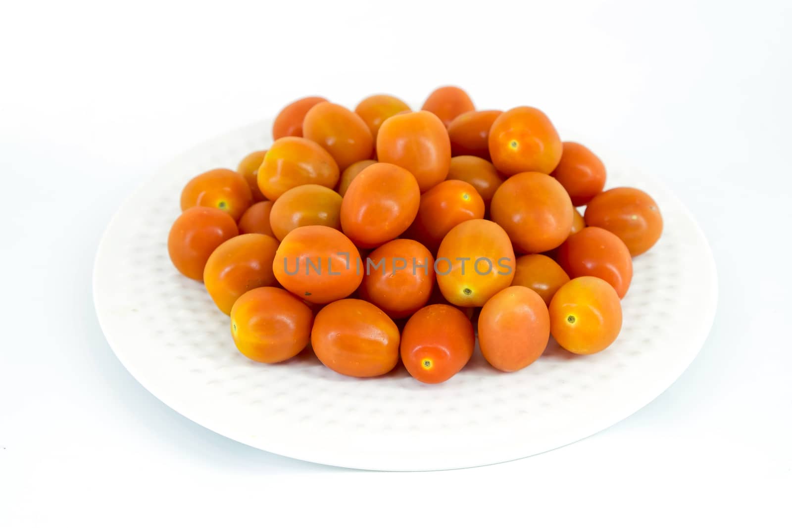 Cherry tomatoes in white plate by art9858